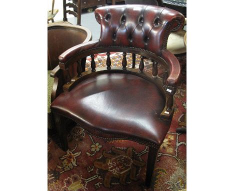 20th Century ox blood leather button back office armchair, together with an early 20th Century tub type chair. (B.P. 24% incl