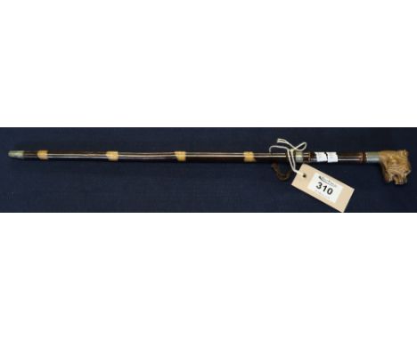 Short bamboo swagger stick with carved bulldogs head terminal. (B.P. 24% incl. VAT)