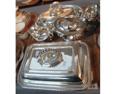 Tray of silver plate to include; two entree dishes of oval and rectangular form, together with fluted three piece tea service