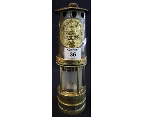 Ackroyd & Best Ltd brass miner's safety lamp with stamp no. 394, in used condition.(B.P. 24% incl. VAT)