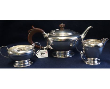 Silver three piece baluster shaped teaset, the teapot with wooden handle and finial. Birmingham hallmarks. 22 troy ozs approx