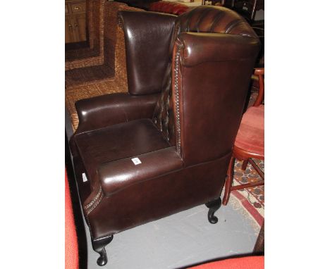 Thomas Lloyd leather button back Chippendale style wing armchair.(B.P. 24% incl. VAT)