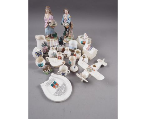 A quantity of crested china and Goss, including a "Good Luck" black cat, and two Continental figures, 8" high 