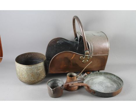 A 19th century copper coal shute, a copper frying pan, two measures, a warming pan, an Indian brass bowl and a reconstituted 