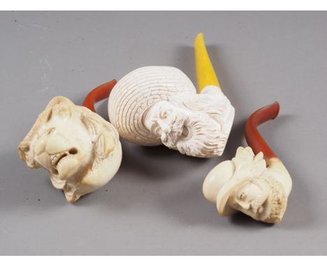 A Meerschaum "Turks head" pipe, 6 1/2" long, a Meerschaum "lion head" pipe, 6" long, and one other pipe, 5 1/2" long 