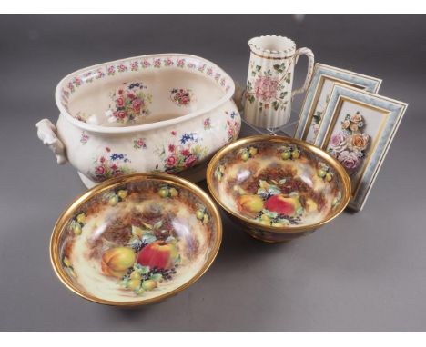 An early 20th century foot bath with floral decoration, a similar jug, a pair of Raymond Everill Lime House Studio bowls with