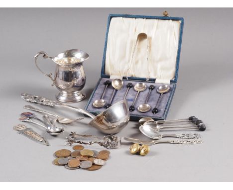 A Norwegian silver openwork handle ladle, a similar butter knife and preserve spoon, a silver cream jug and other silver teas