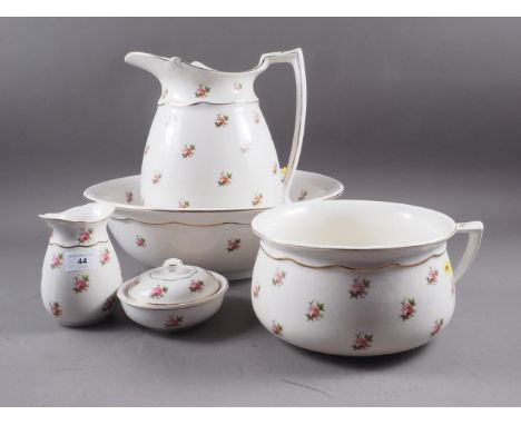 An early 20th century Bristol floral decorated toilet set, comprising two jugs, basin, chamber pot and a soap dish, retailed 