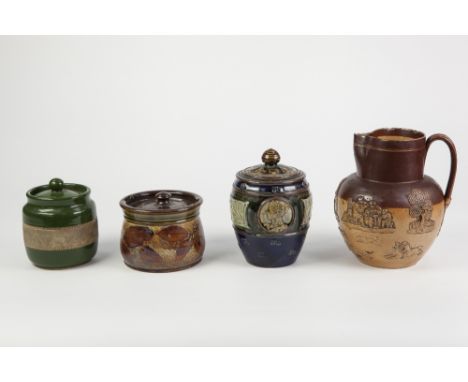 DOULTON LAMBETH ROYAL COMMEMERATIVE MOULDED POTTERY TOBACCO JAR AND COVER, of ovoid form with domed cover, decorated in the m