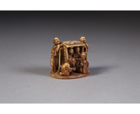 A GOOD 19TH CENTURY JAPANESE CARVED IVORY NETSUKE IN THE FORM OF TRAVELLERS being carried in   a Norimono with other figures 