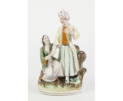 NINETEENTH CENTURY STAFFORDSHIRE POTTERY GROUP OF MR. HARWOOD AND MISS ROSA HENRY AS 'SELIM AND ZULEIKA' FROM THE 'BRIDE OF A