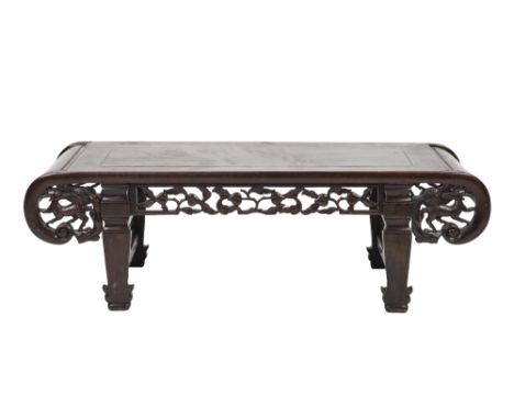 A LATE 19TH/EARLY 20TH CENTURY CHINESE HARDWOOD LOW TABLE WITH SCROLL ENDS, the frieze pierced and carved foliated beach and 