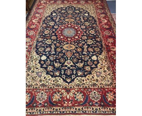 An Isfahan ivory ground carpet 340 x 235cm