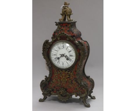 A 19th century buhl mantel clock, ormolu-mounted and having white enamelled dial with Roman and Arabic numerals, the acanthus