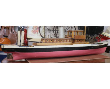 A model of a steam boat with glazed wheel house