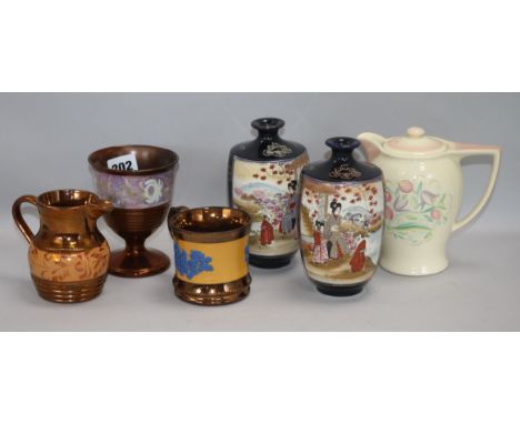 Three items of lustreware, a pair of Satsuma vases and a Susie Cooper jug