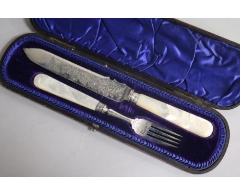 A cased Victorian mother of pearl handled silver serving knife and fork by James Deakins & Sons, Sheffield, 1894.