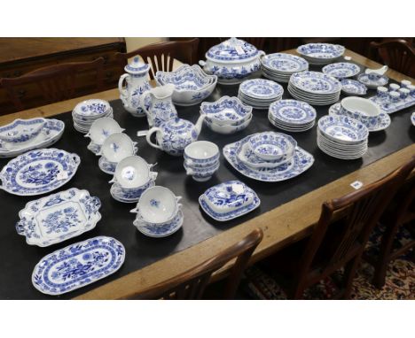 A quantity of Hutschenreuther, Germany, Blue Onion pattern dinner wares, comprising: soup tureen and cover, water jug, butter