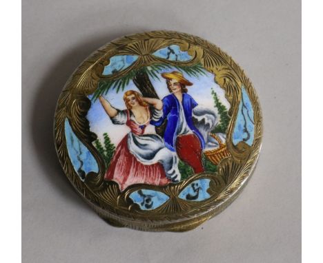 A late 19th/early 20th century continental engraved 800 white metal and enamel circular compact, 7cm.
