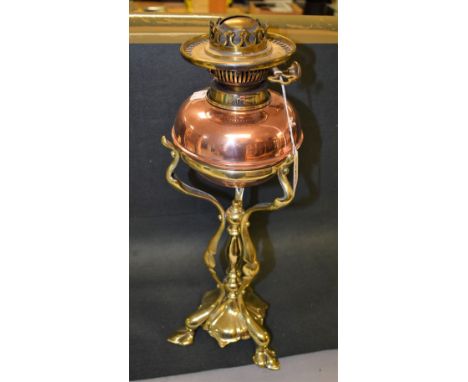 An Art Nouveau copper and brass table oil lamp, in the manner of W.A.S. Benson, Duplex type burner with adjustable stage, the