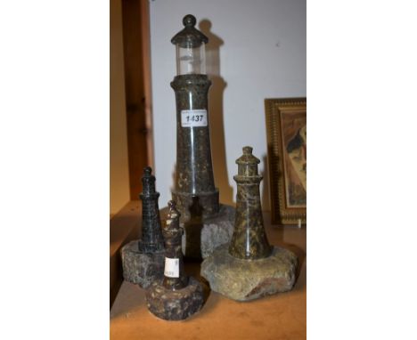 An early 20th century Cornish serpentine novelty table lamp, as a lighthouse, 31cm high; a harlequin garniture of three gradu