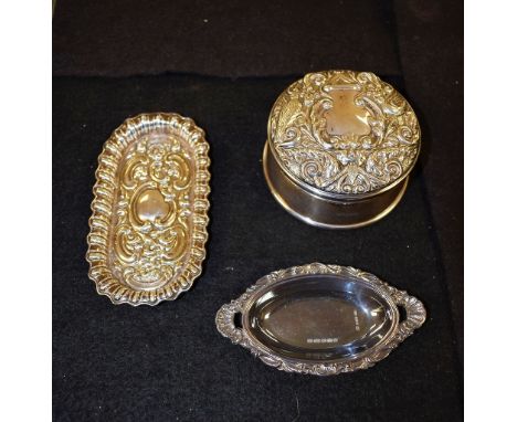 A silver dressing table tidy with hinged cover, Birmingham 1992; a trinket dish, London 1901; another, Birmingham (3)