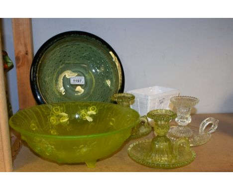 An early 20th century uranium glass bowl, the exterior in relief with roses,  three spur feet, 25cm diam;  a pair of  lime gr