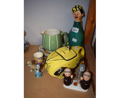 A Wade Whimsie Booboo, others some Disney dogs; a Sadler novelty motor car teapot in yellow, OKT42 number plate; a novelty mu