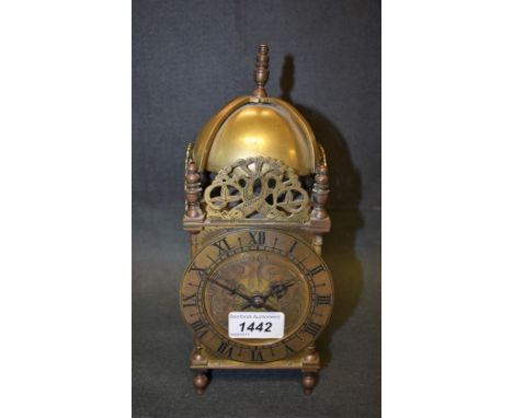 A brass lantern clock