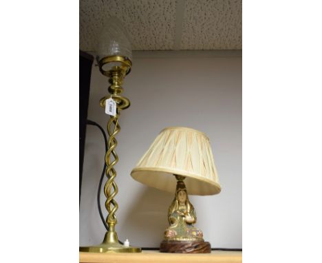 A brass twisted stem table lamp, cut glass shade; another Satsuma lamp, in the form of a seated woman (2)