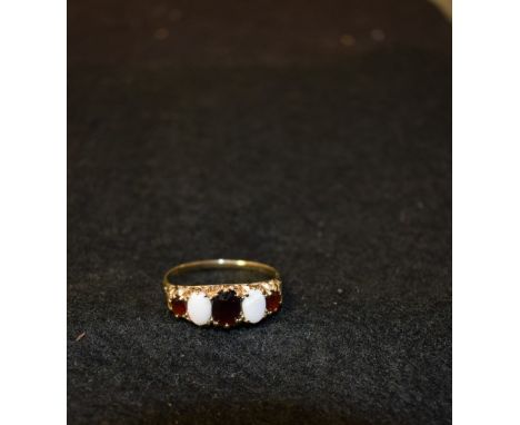 A lady's opal and garnet ring, 2.4g