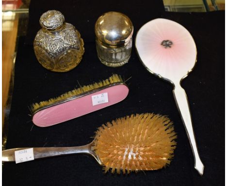 A pink enamelled white metal three piece dressing table set, hand mirror, cloths and hair brushes;  cut glass silver mounted 