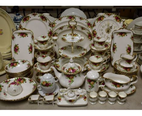 A Royal Country Old Country Roses pattern dinner and tea service including dinner plates, side plates, teapot, cups, saucers,
