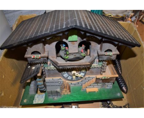 A German musical automaton cuckoo clock with water wheel, three pine cone weights