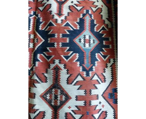 AN ANTIQUE CAUCASIAN KELIM CARPET. 328 X 180CM