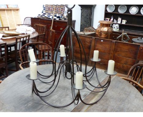 A WROUGHT IRON SIX LIGHT HANGING CHANDELIER OF SCROLLING FORM.  H.83cms D.83cms