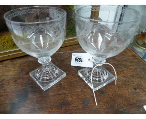 A NEAR PAIR OF ANTIQUE MASONIC DECORATED WINE GLASSES WITH LEMON SQUEEZER BASES