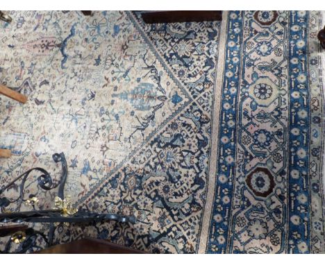 A LARGE ANTIQUE PERSIAN HAMADAN CARPET. 620 X 332CM