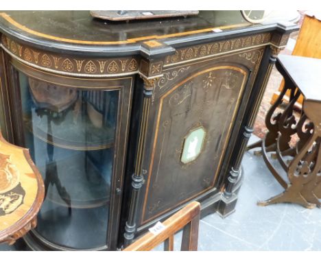 A VICTORIAN AESTHETIC EBONISED CREDENZA WITH GLAZED BOW SIDES AND CENTRAL DOOR WITH JASPER PLAQUE.