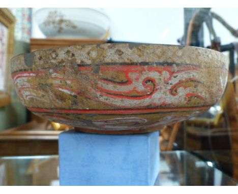 AN INTERESTING POTTERY BOWL WITH STYLIZED CELTIC DESIGNS.  D.20cms.
