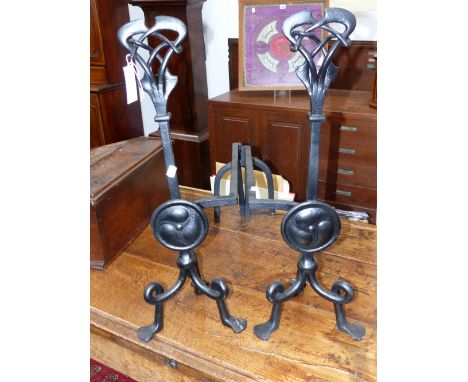 A PAIR OF ART NOUVEAU WROUGHT IRON ANDIRONS INTERTWINED PIERCED KNOPS, SHAFTS WITH ROUNDELS. TRIFID SCROLL FEET, DESIGNED BY 