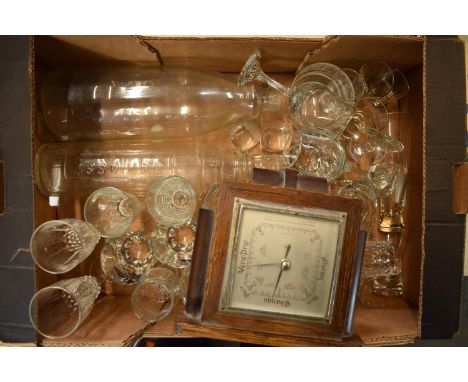 A mixed collection of items to include a wooden cased mantle barometer, 2 large glass bottles and a collection of glassware t