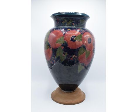 Impressive Moorcroft bulbous vase in the Pomegranate design mounted on a newer wooden base. Standing at 47cm tall, we suspect