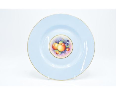 A Royal Worcester 27cm diameter dinner plate with a fruit scene design surrounded by a light blue background signed Cooper. T