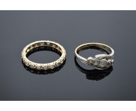 An antique gold eternity ring set with clear stones (tests as 9ct) UK size K/L (gross weight 1.3 grams) together with a 9ct g