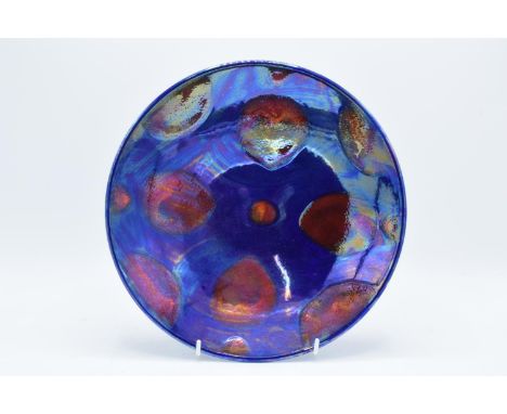 Poole Pottery charger with a lustre glaze. In good condition with no obvious damage or restoration. 27cm diameter. 