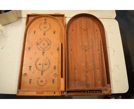 A pair of 20th century wooden bagatelle games complete with associated balls. One is made by Chad Valley (left) and the other