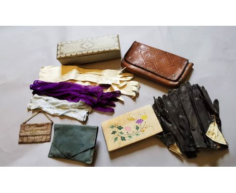 A collection of bags to include a 1940's leather, long bag, with the initial M A in a decorative band, a teal suede envelope 