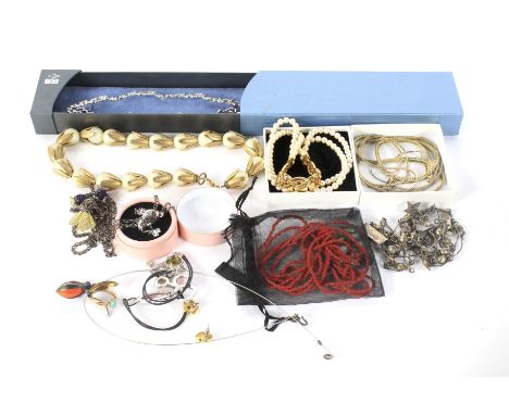 An assortment of costume jewellery. Including two Swarovski necklaces, an synthetic pearl necklace, a necklace stamped 'HP 14