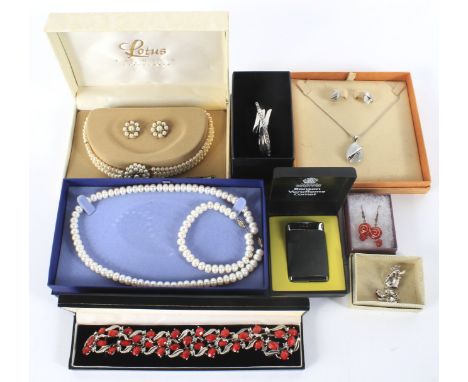 An assortment of costume jewellery. Including a gold plated pearl necklace and earring set, a bangle, pair of earrings, etc